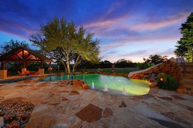 1298 Mystic Pkwy, Spring Branch, TX 78070 - view of pool featuring a gazebo, a water slide, an in-ground hot tub, a patio, and a fenced backyard