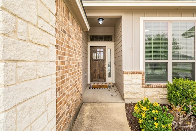 1310 Neuberry Clf, Temple, TX 76502 - doorway to property with board and batten siding, stone siding, and brick siding