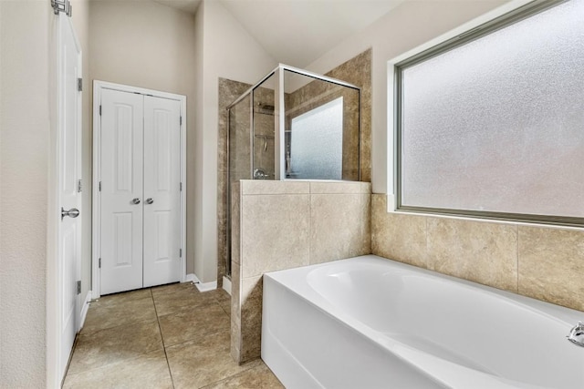 1310 Neuberry Clf, Temple, TX 76502 - bathroom with a shower stall, a garden tub, and tile patterned flooring
