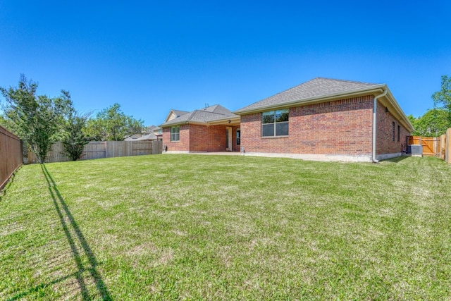 2801 Mirasol Dr, Round Rock, TX 78681 - rear view of house with brick siding and central air condition unit
