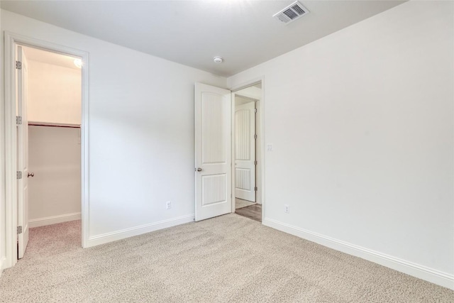 2801 Mirasol Dr, Round Rock, TX 78681 - unfurnished bedroom with carpet flooring, baseboards, a spacious closet, and a closet
