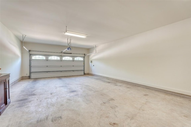 2801 Mirasol Dr, Round Rock, TX 78681 - garage with a garage door opener and baseboards