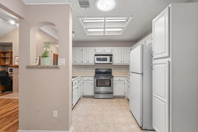 840 Eagles Way, Leander, TX 78641 - kitchen with white appliances, white cabinetry, and light countertops