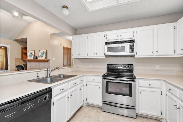 840 Eagles Way, Leander, TX 78641 - kitchen featuring white microwave, dishwasher, stainless steel electric range oven, and white cabinets