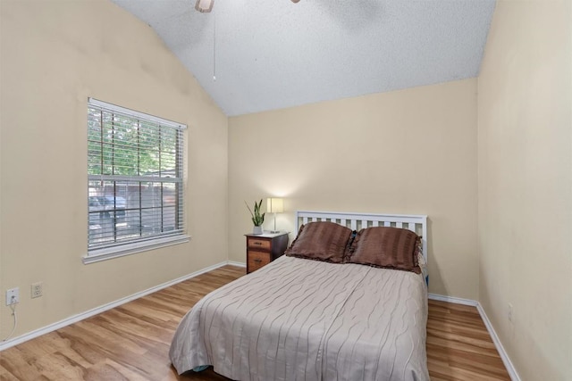 840 Eagles Way, Leander, TX 78641 - bedroom with lofted ceiling, wood finished floors, a textured ceiling, and a ceiling fan