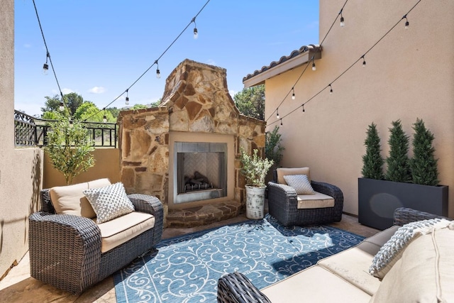 1306 High Lonesome, Leander, TX 78641 - view of patio / terrace with an outdoor living space with a fireplace