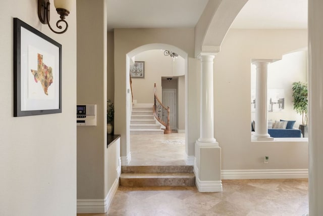 1306 High Lonesome, Leander, TX 78641 - hallway with stairs, arched walkways, and decorative columns