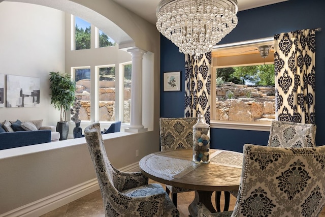 1306 High Lonesome, Leander, TX 78641 - dining area with plenty of natural light, arched walkways, decorative columns, and a chandelier