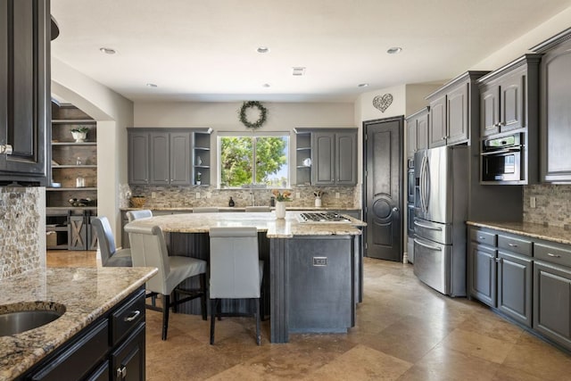 1306 High Lonesome, Leander, TX 78641 - kitchen featuring open shelves, tasteful backsplash, stainless steel appliances, a kitchen island, and recessed lighting