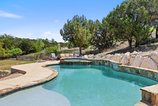 1306 High Lonesome, Leander, TX 78641 - view of swimming pool featuring a fenced backyard, a patio area, and a pool with connected hot tub