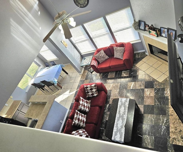 14400 Little Eagle Ct, Elgin, TX 78621 - living room featuring ceiling fan and a fireplace