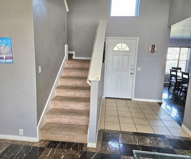 14400 Little Eagle Ct, Elgin, TX 78621 - foyer entrance with stairs, a high ceiling, and baseboards