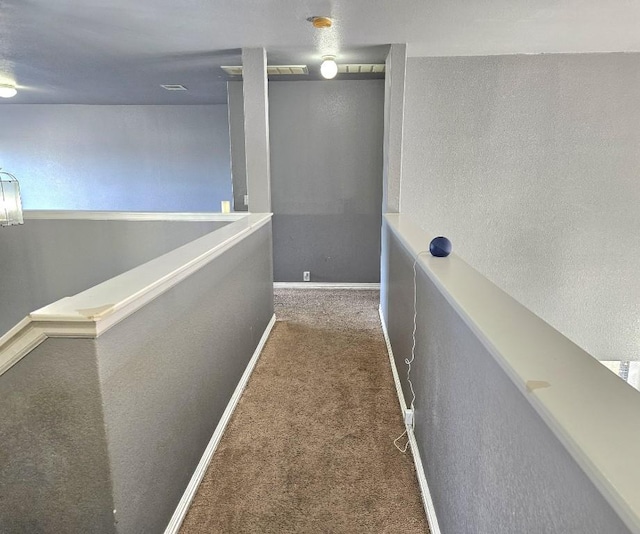 14400 Little Eagle Ct, Elgin, TX 78621 - hallway with visible vents, carpet flooring, a textured wall, and baseboards