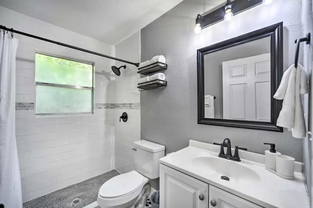 1026 Haynes St Unit 28, San Marcos, TX 78666 - full bathroom featuring a textured wall, vanity, and a tile shower