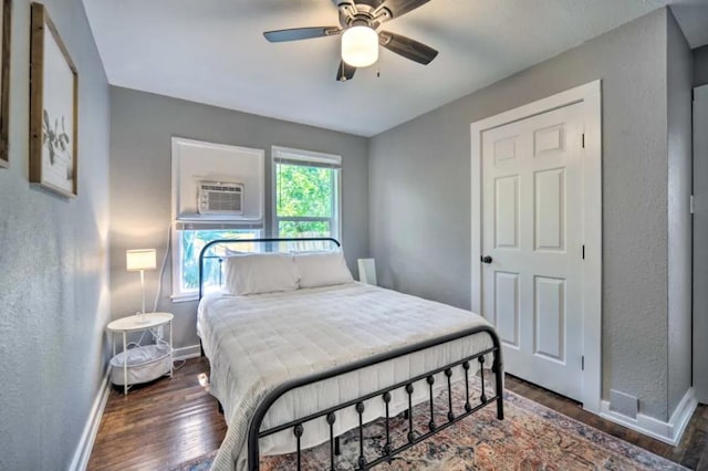 1026 Haynes St Unit 28, San Marcos, TX 78666 - bedroom featuring wood finished floors, a textured wall, and a ceiling fan