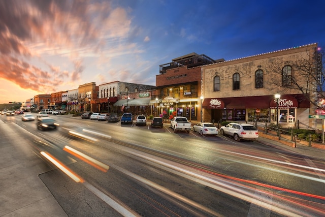 1026 Haynes St Unit 28, San Marcos, TX 78666 - property at dusk featuring view of commercial area