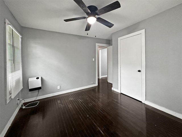 1026 Haynes St Unit 28, San Marcos, TX 78666 - unfurnished bedroom featuring hardwood / wood-style flooring, heating unit, and ceiling fan