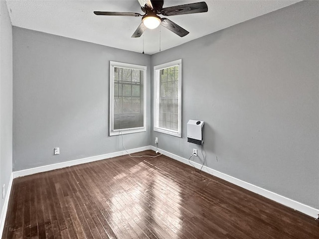1026 Haynes St Unit 28, San Marcos, TX 78666 - unfurnished room featuring ceiling fan, wood-type flooring, and heating unit