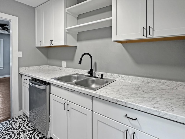 1026 Haynes St Unit 28, San Marcos, TX 78666 - kitchen featuring dishwasher, open shelves, white cabinets, and light countertops