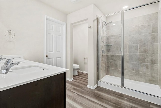8516 Cantera Ridge Rd, Temple, TX 76502 - bathroom with toilet, a shower stall, vanity, and wood finished floors