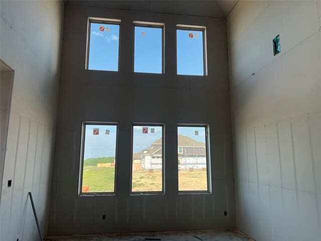 940 Sunny Ridge Dr, Leander, TX 78641 - unfurnished room featuring healthy amount of natural light and a high ceiling