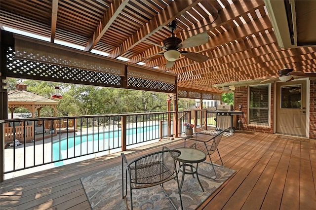 deck featuring ceiling fan and a gazebo