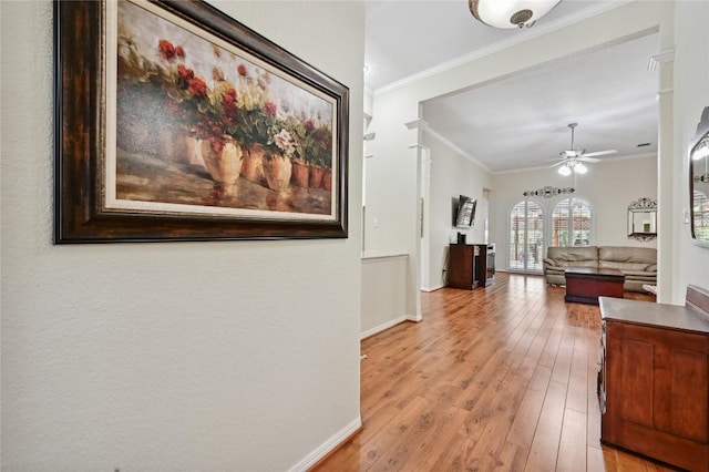 11446 Rustic Rock Dr, Austin, TX 78750 - hall with light wood-style floors and ornamental molding
