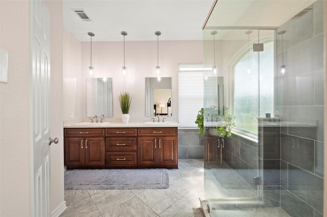 3420 Benecia Ct, Austin, TX 78738 - full bath with double vanity, a shower stall, and marble finish floors