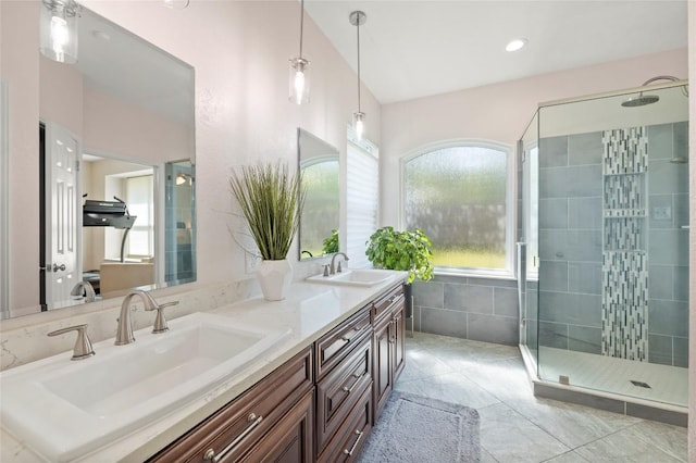 3420 Benecia Ct, Austin, TX 78738 - bathroom featuring double vanity, healthy amount of natural light, a shower stall, and tile patterned flooring