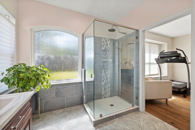 3420 Benecia Ct, Austin, TX 78738 - full bathroom featuring a shower stall, healthy amount of natural light, and vanity