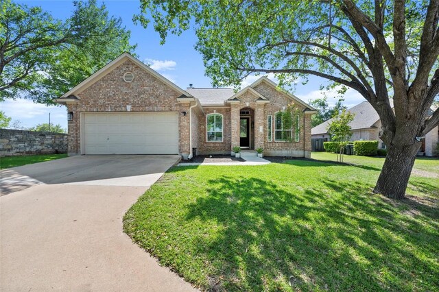 3420 Benecia Ct, Austin, TX 78738 - view of front facade featuring brick siding, a garage, driveway, and a front lawn