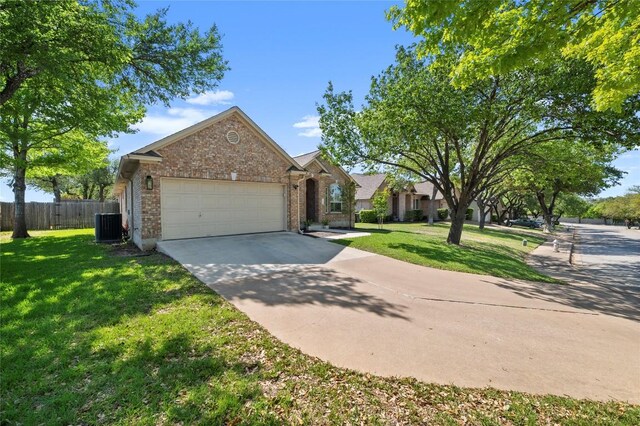 3420 Benecia Ct, Austin, TX 78738 - view of front of house featuring brick siding, an attached garage, and driveway