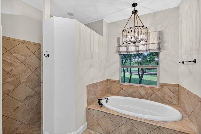 104 Double Cir, Burnet, TX 78611 - bathroom with a bath and a chandelier