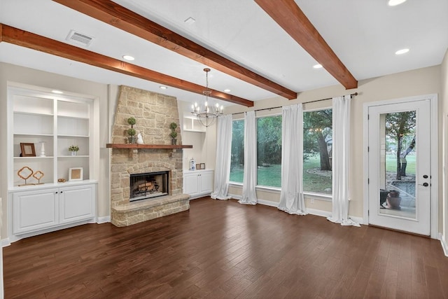 104 Double Cir, Burnet, TX 78611 - unfurnished living room with wood finished floors, a chandelier, a stone fireplace, beamed ceiling, and recessed lighting