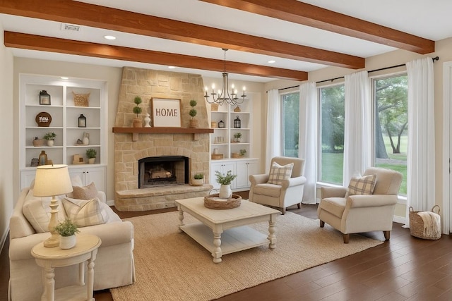 104 Double Cir, Burnet, TX 78611 - living room with beam ceiling, wood finished floors, a chandelier, a fireplace, and recessed lighting