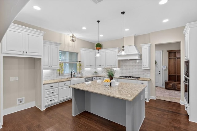 104 Double Cir, Burnet, TX 78611 - kitchen featuring white cabinetry, a kitchen island, backsplash, dark wood-style floors, and recessed lighting