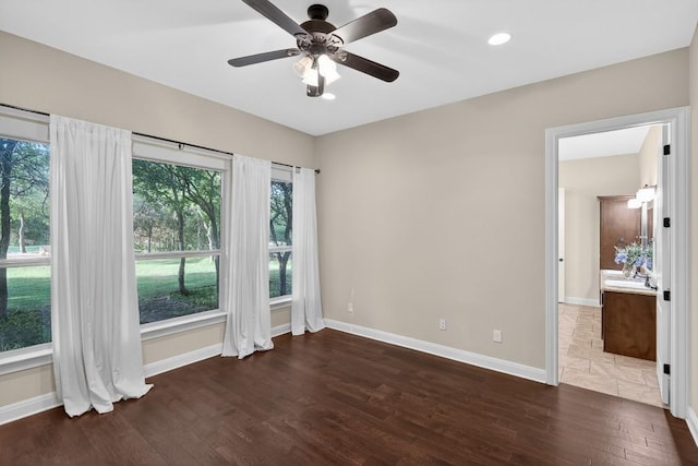 104 Double Cir, Burnet, TX 78611 - unfurnished room with wood finished floors and ceiling fan