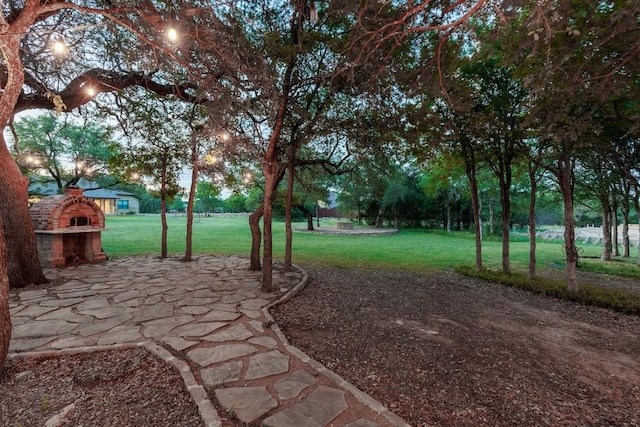 104 Double Cir, Burnet, TX 78611 - view of grassy yard featuring a patio