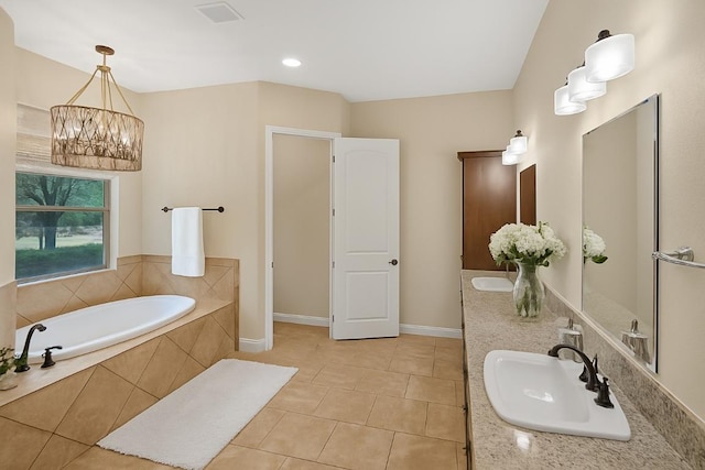 104 Double Cir, Burnet, TX 78611 - bathroom with double vanity, a garden tub, a chandelier, and tile patterned flooring