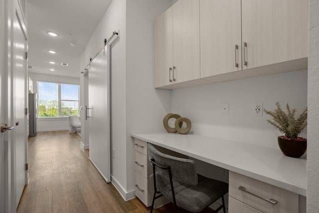 6324 N Lamar Blvd Unit 313, Austin, TX 78752 - office space with built in desk, wood finished floors, recessed lighting, and a barn door