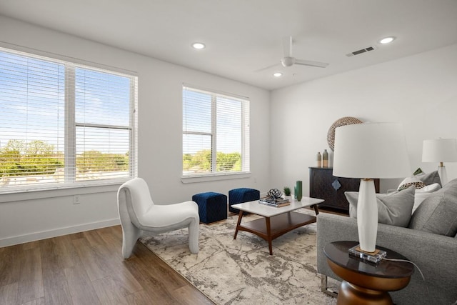 6324 N Lamar Blvd Unit 313, Austin, TX 78752 - living room with wood finished floors, a ceiling fan, baseboards, and recessed lighting