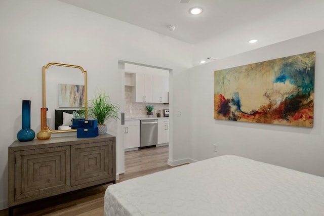 6324 N Lamar Blvd Unit 313, Austin, TX 78752 - bedroom with light wood-style flooring and recessed lighting