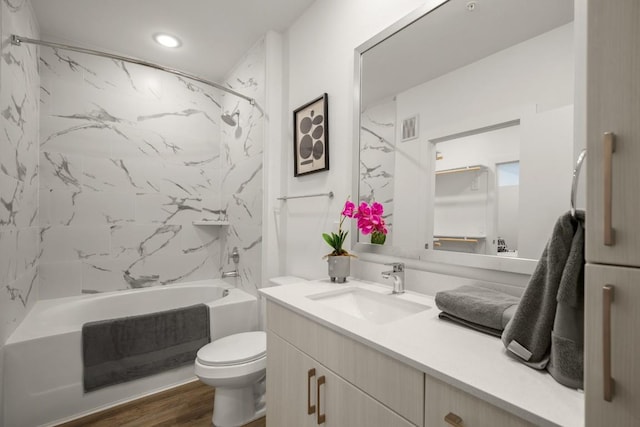 6324 N Lamar Blvd Unit 313, Austin, TX 78752 - bathroom with vanity, toilet, shower / washtub combination, wood finished floors, and recessed lighting