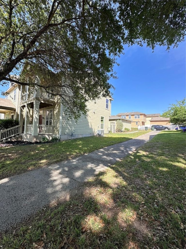175A Michaelis Unit A, Kyle, TX 78640 - view of home's exterior with a lawn