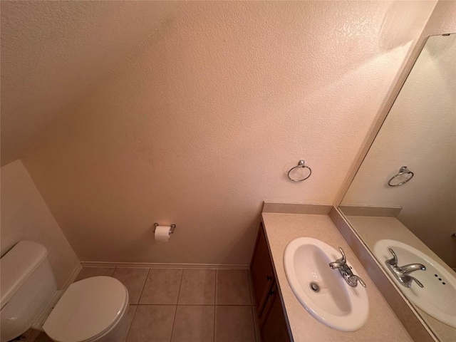 175A Michaelis Unit A, Kyle, TX 78640 - half bath with toilet, vanity, tile patterned floors, and baseboards