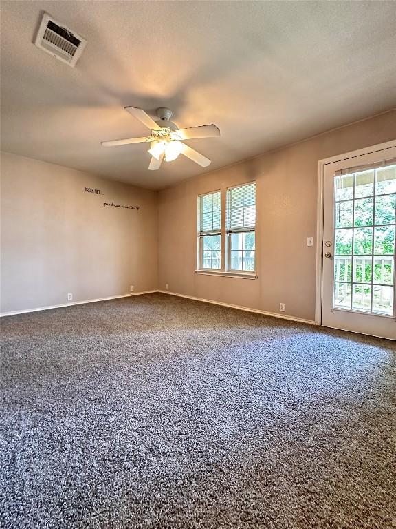 175A Michaelis Unit A, Kyle, TX 78640 - carpeted empty room featuring baseboards and ceiling fan