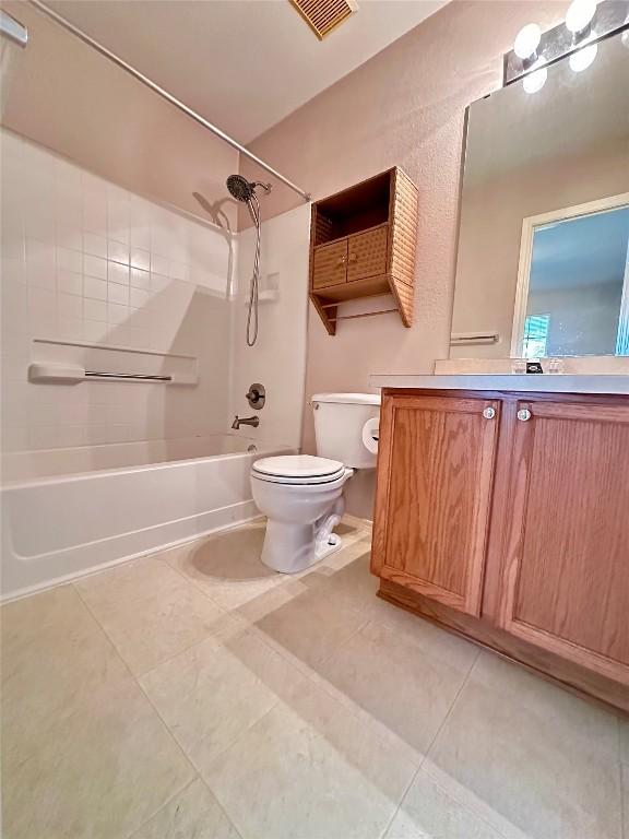 175A Michaelis Unit A, Kyle, TX 78640 - bathroom with shower / bath combination, toilet, vanity, and tile patterned floors