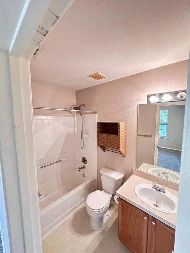 175A Michaelis Unit A, Kyle, TX 78640 - full bath with a textured wall, shower / tub combination, vanity, toilet, and a textured ceiling