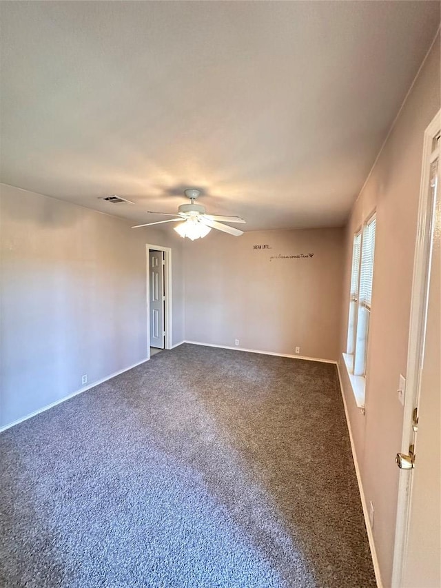 175A Michaelis Unit A, Kyle, TX 78640 - unfurnished room with ceiling fan, dark colored carpet, and baseboards