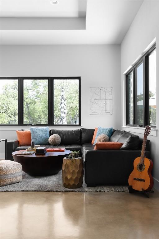 7817 Orisha Dr, Austin, TX 78739 - living room featuring plenty of natural light and finished concrete flooring